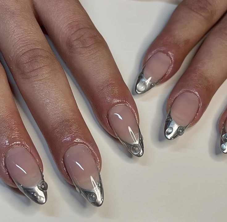 Chic Almond-Shaped Nails: Translucent Base with Edgy Metallic Tips