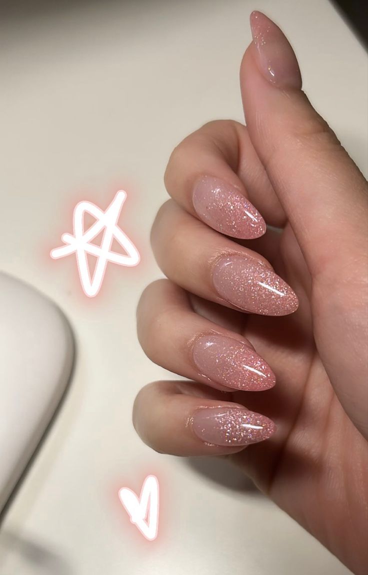 Elegant Ombre Sparkly Nude Nails with Almond-Shaped Tips for Sophisticated Femininity.