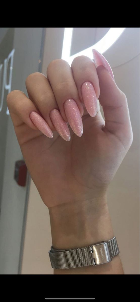 Elegant Pastel Pink Gradient Nail Design with Shimmer and Almond Shape.