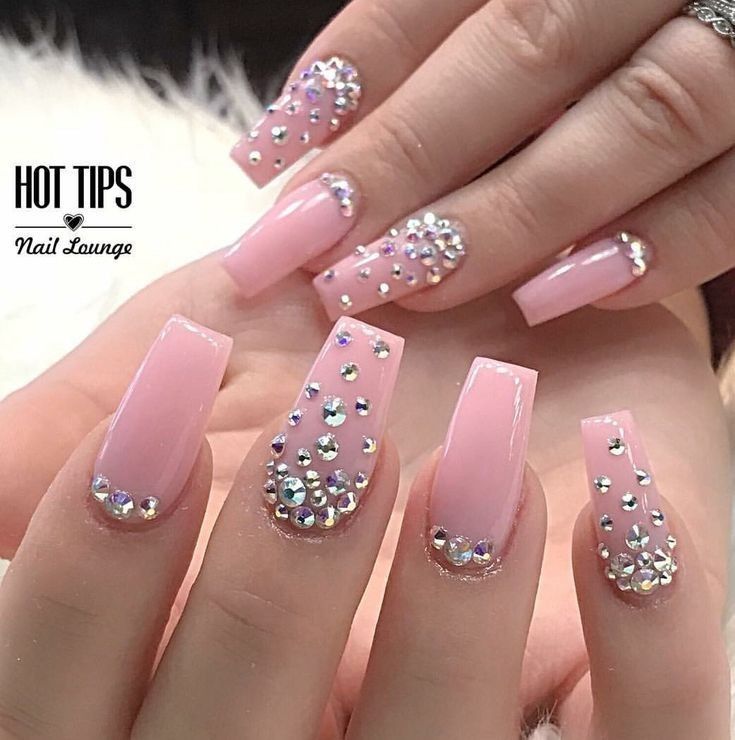 Chic Long Square-Tipped Nail Design with Soft Pink Polish and Sparkling Rhinestones.