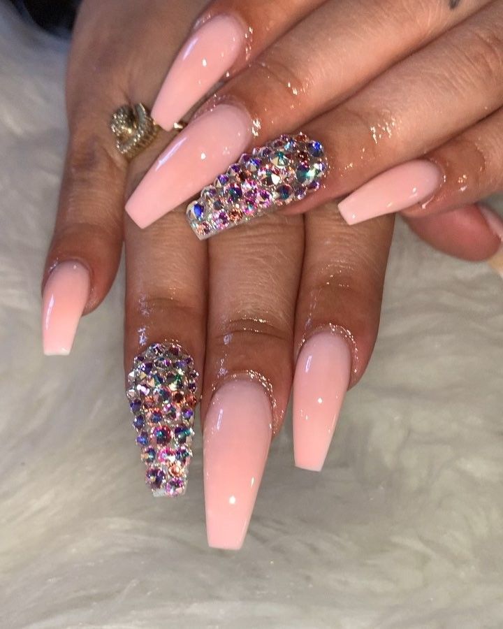 Chic Long Pink Nails Enhanced with Glamorous Rhinestone Accents.