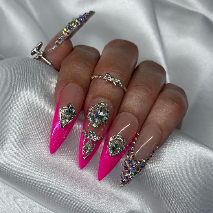 Glamorous Pink and Clear Crystal Nail Design with Bold Gemstone Accents.