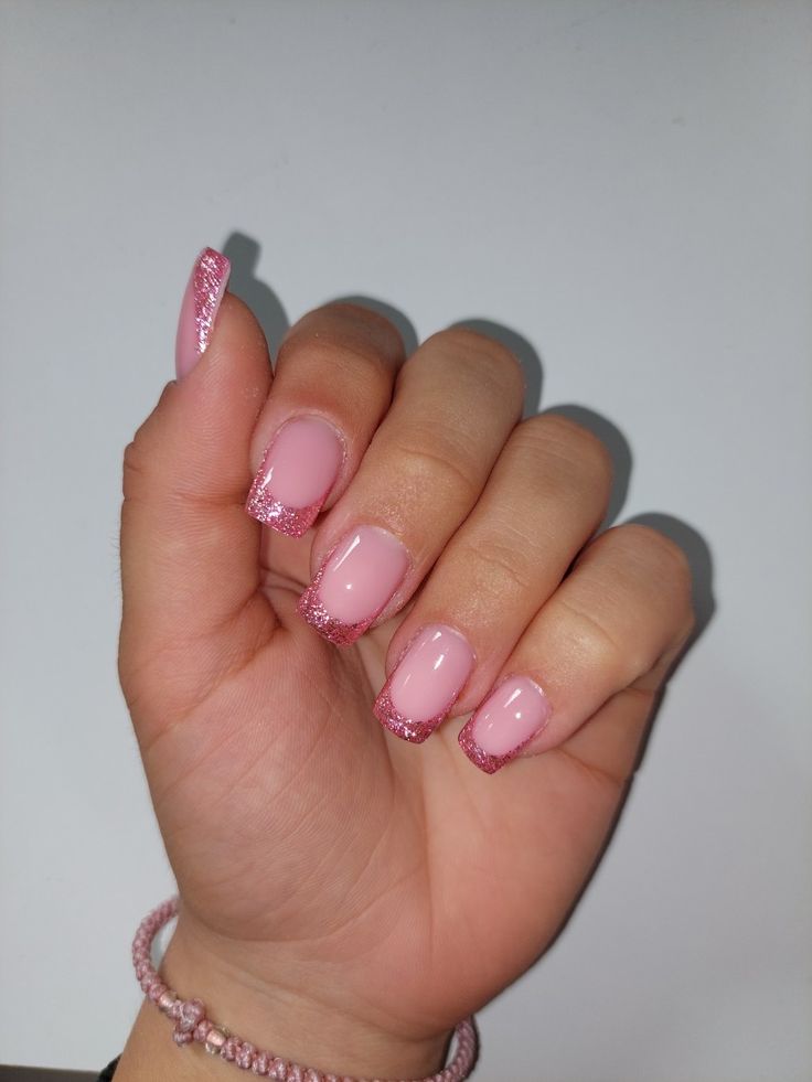 Chic Delicate Pink Manicure with Glossy Base and Glitter Tips