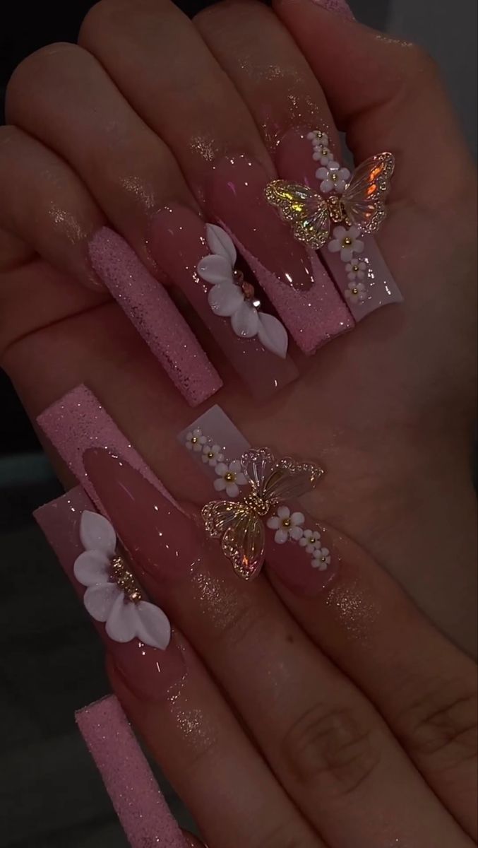 Captivating Pink Nail Design with Glitter, Floral Accents, and Iridescent Butterflies.