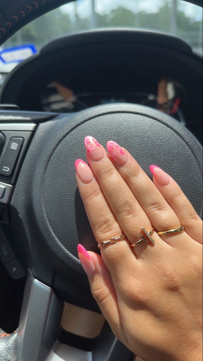 Elegant Pink Ombre Nail Design with Glossy Finish and Chic Accessories.