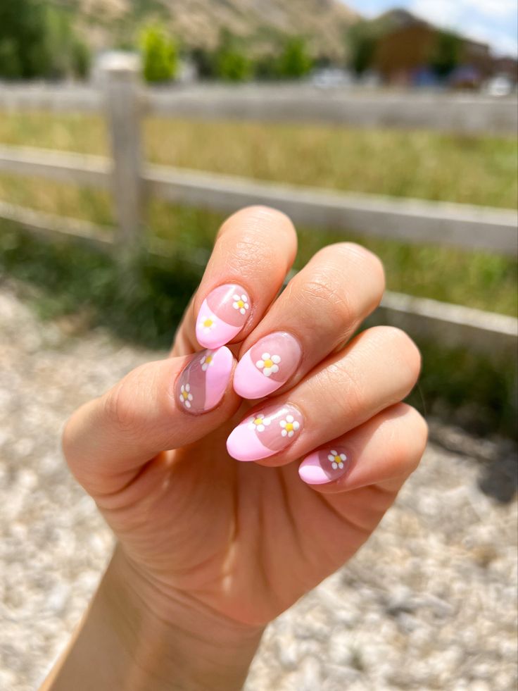 Charming Spring-Inspired Nail Design with Soft Pink Base and Floral Accents