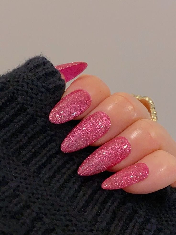 Elegant Almond-Shaped Glittering Pink Nails for Any Occasion.