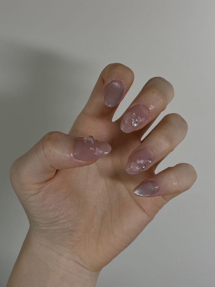 Chic Soft Pink Nail Design with Glossy Finish and Silver Gem Accents