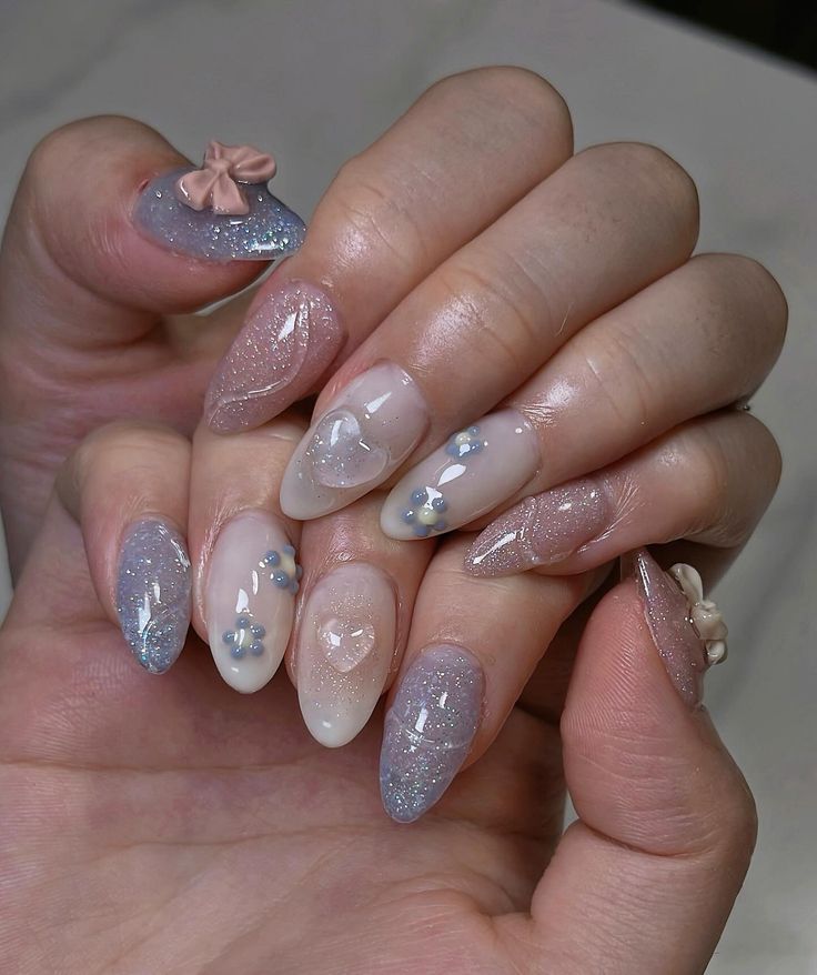 Elegant and Playful Nail Design with Soft Colors and Shimmering Accents.