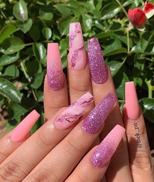 Elegant Soft Pink and Glittering Nail Design with Marble Accents