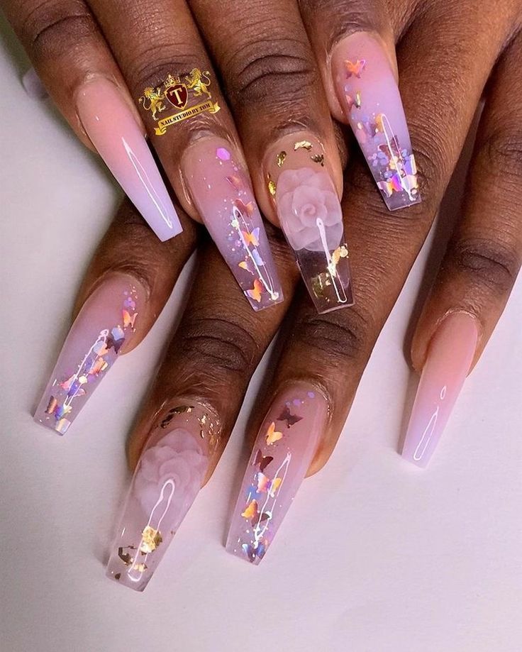 Sophisticated Ombre Long Nails with Floral Patterns and Butterfly Accents