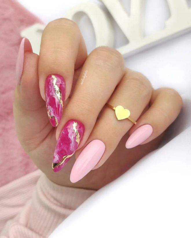 Chic Almond-Shaped Nail Design with Pink and Gold Elements