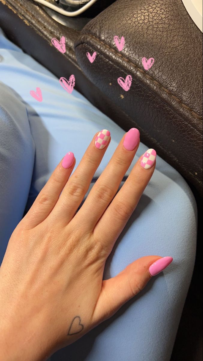 Vibrant Pink Nail Art: Trendy Solid and Checkered Designs for a Youthful Look.