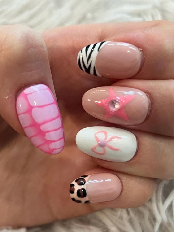 Playful Vibrant Nail Design: Chic Pink Crocodile, Zebra Stripes, and Gem-Embellished Stars.