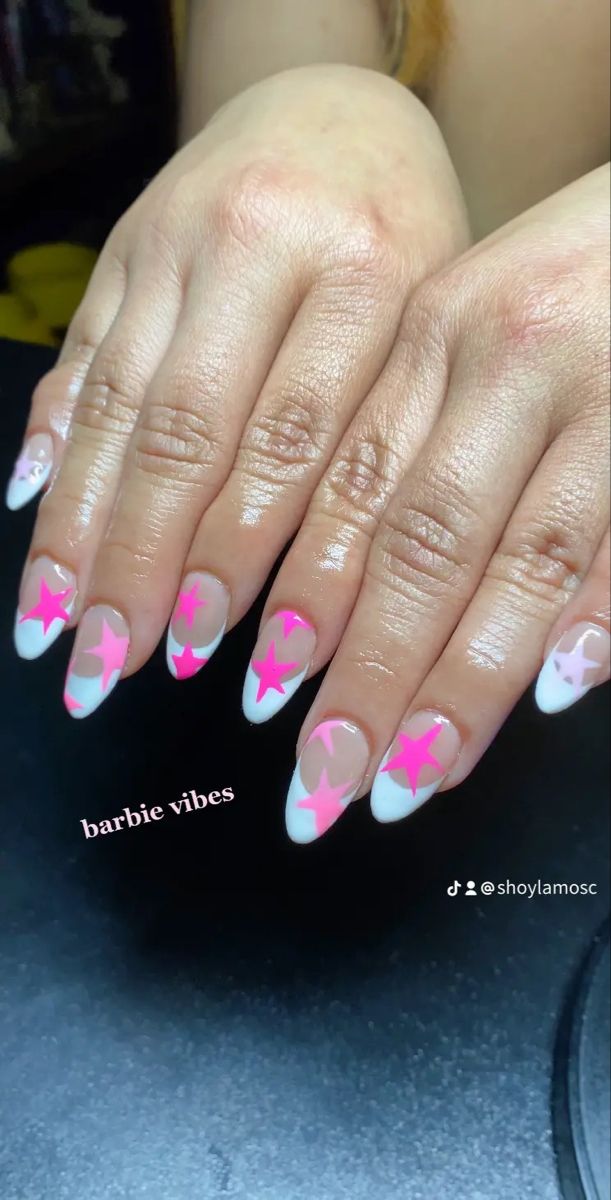 Vibrant Chic Nail Design: Playful Pink and White with Bold Star Accents