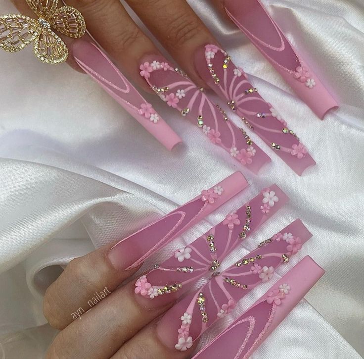 Whimsical Long Pink Nails with Butterfly Designs and Floral Rhinestones