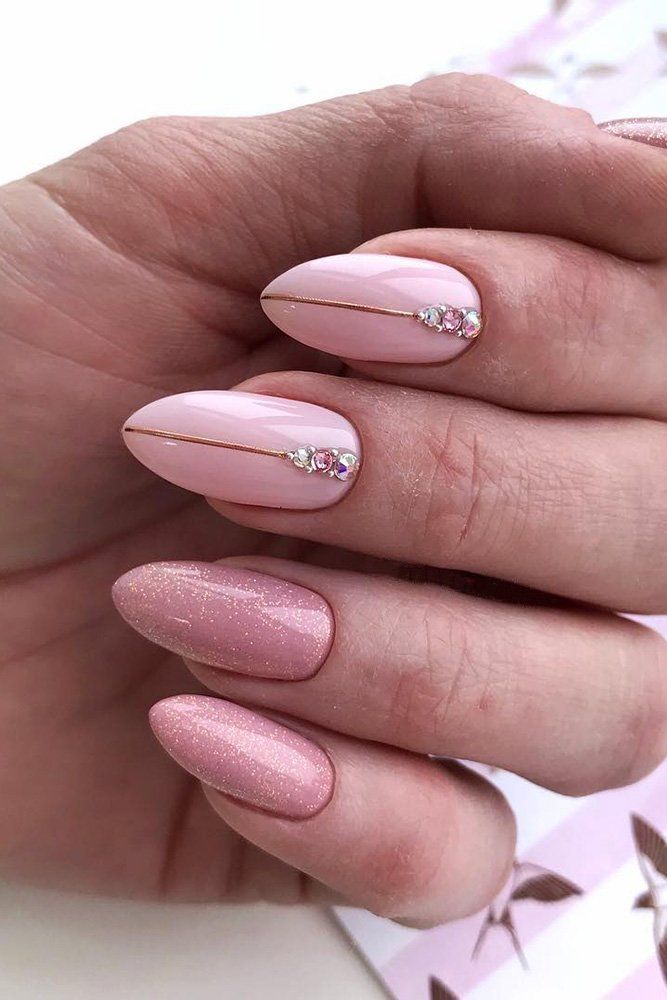 Sophisticated Soft Pink Nail Design with Glossy Finish and Elegant Gold Accents.