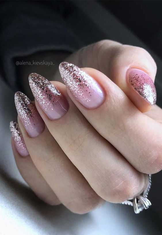 Elegant Ombre Nail Design: Soft Pink to Glittery Metallic with Shimmer for Glamorous Occasions.