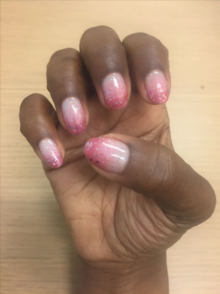 Whimsical Ombre Nail Design with Sparkling Pink Gradient.