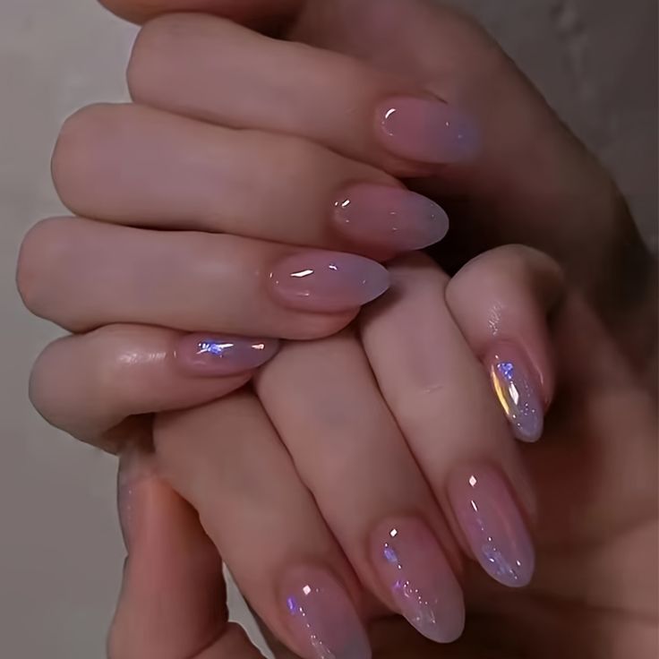 Elegant Gradient Nail Design with Translucent Hues and Iridescent Accents.