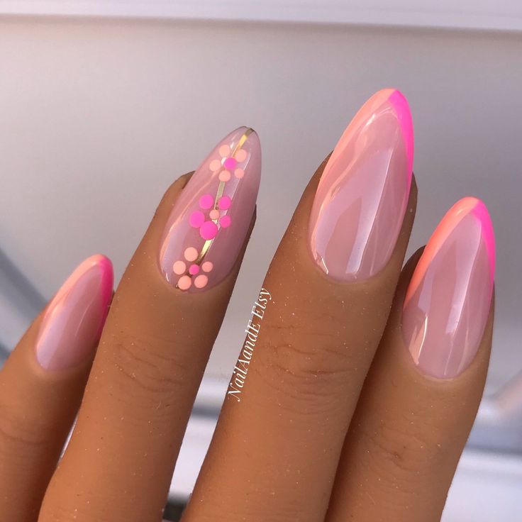 Charming Modern Elegance: Nude Nails with Vibrant Pink Tips and Floral Accents.