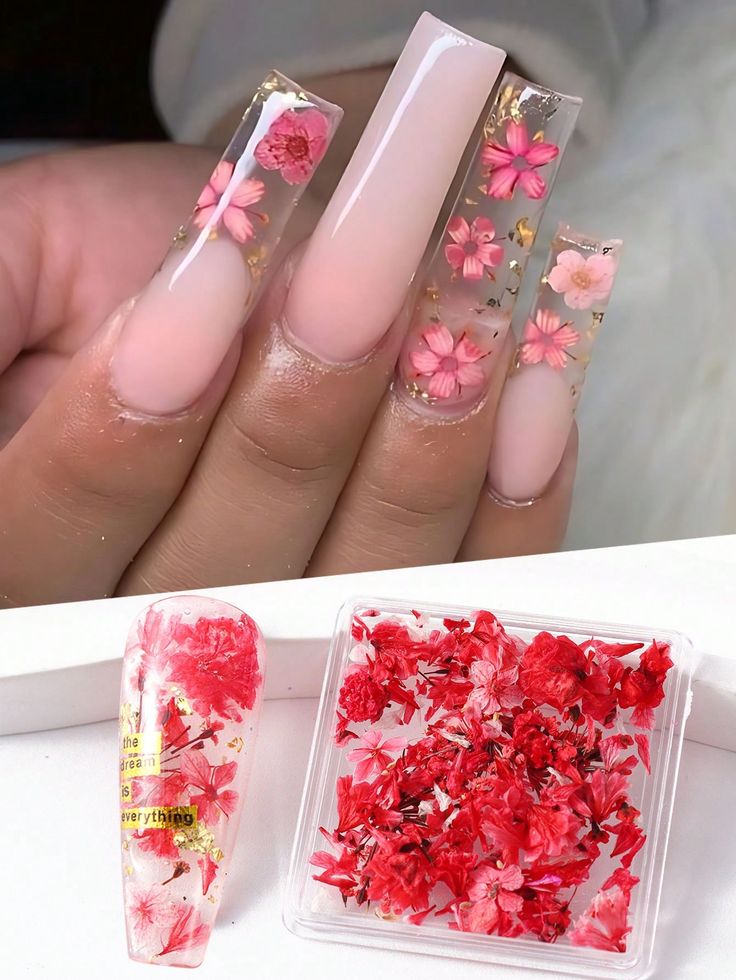 Elegant Floral Nail Design with Transparent Acrylic and Gold Accents.