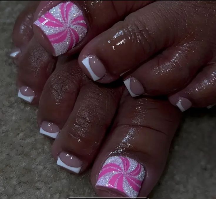 Playful Pink and White Candy Swirl Nail Design with Chic French Tips