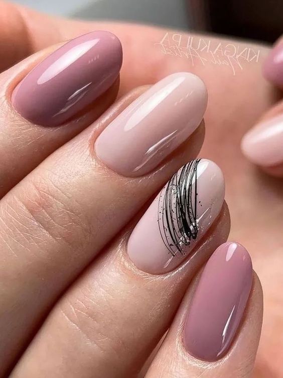 Chic Soft Pink and Mauve Nail Design with Glossy Finish and Artistic Detailing.