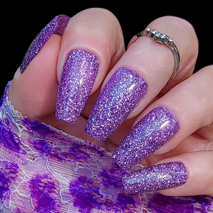 Glamorous Sparkling Purple Coffin Nail Design with Glitter for Special Occasions.