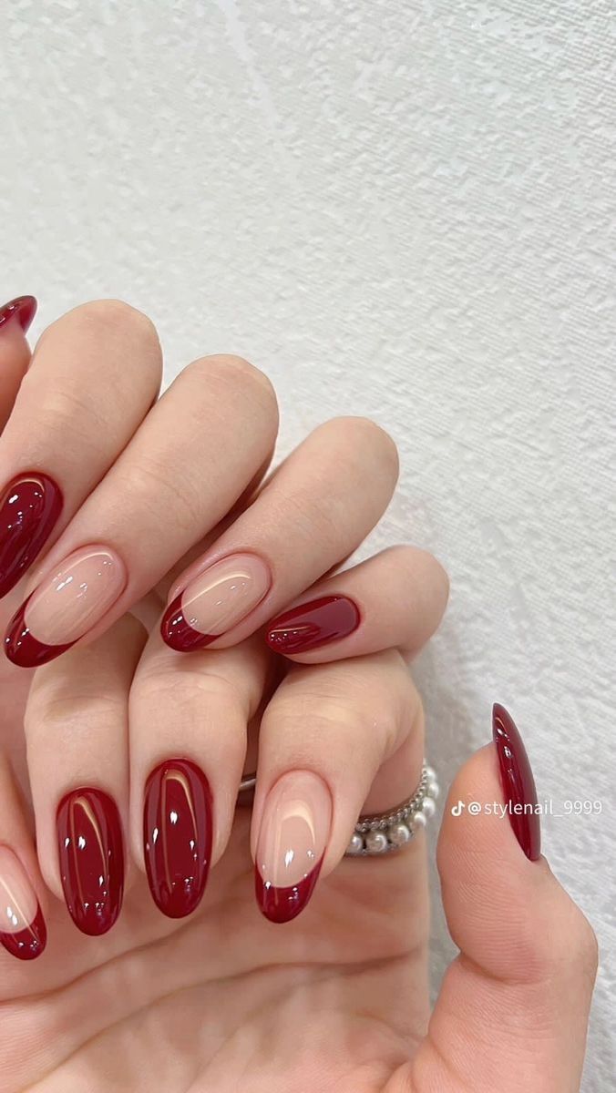 Chic Burgundy and Nude French Tips: A Modern Take on Elegant Nail Design.