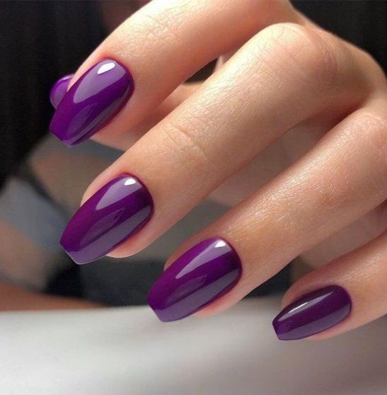 Sophisticated Ombre Purple Manicure with Glossy Finish and Almond Shape.