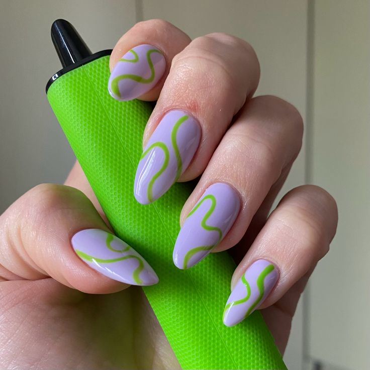 Striking Lilac and Green Swirled Nail Design for a Trendy and Creative Aesthetic.