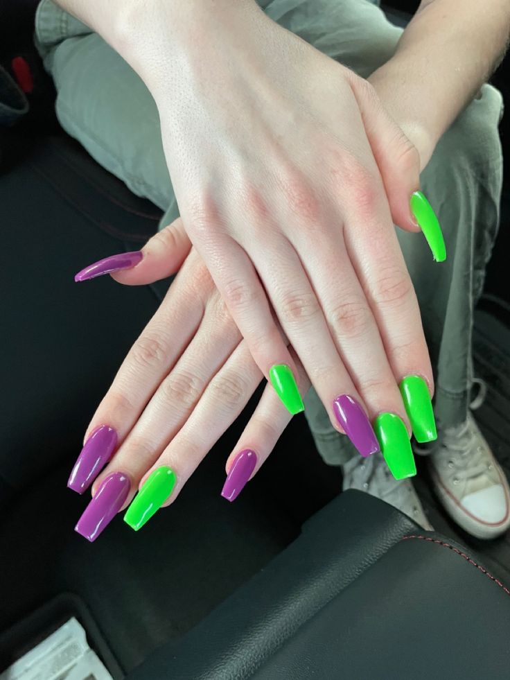 Bold Purple and Green Coffin-Shaped Nail Design: A Playful Statement with Glossy Finish.