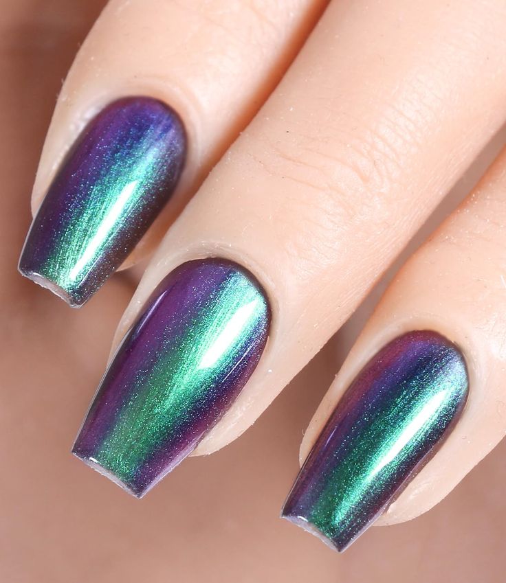 Stunning Metallic Ombre Nails: A Glamorous Blend of Deep Purple and Vibrant Green.