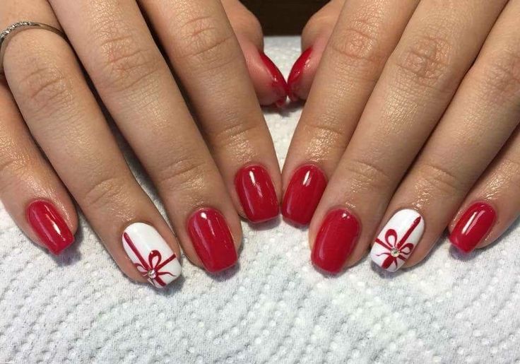 Vibrant Red and White Festive Nail Design with Elegant Ribbons for Holiday Celebrations.