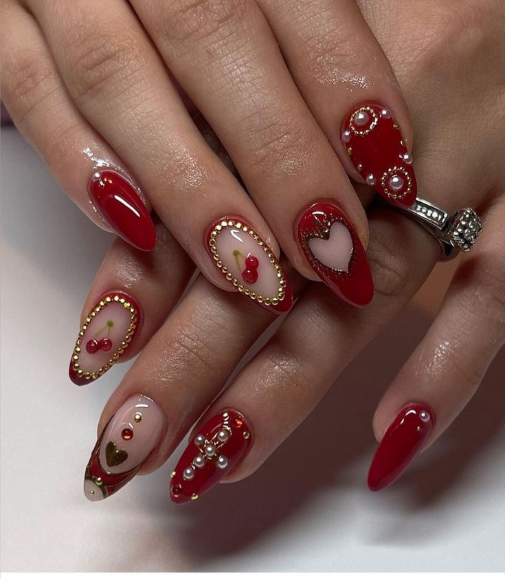 Elegant Festive Nail Design: Deep Red and Nude Tones Embellished with Pearls and Gemstones