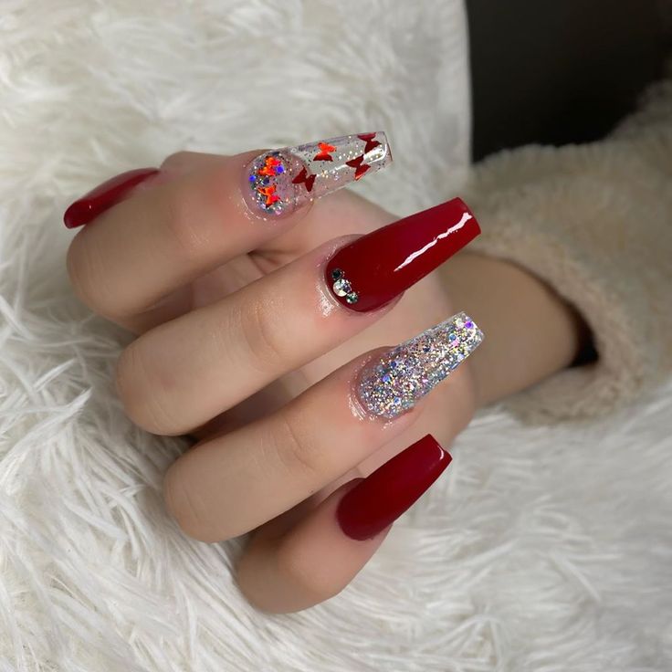 Stunning Vibrant Red Manicure with Glitter Accents for a Bold Statement.