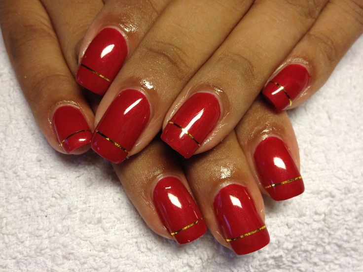 Elegant Chic Red Nails with Gold Accents for Any Occasion