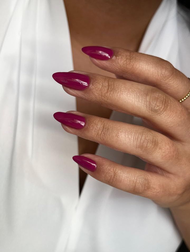 Chic Almond-Shaped Deep Pink Nails: A Bold and Elegant Statement.