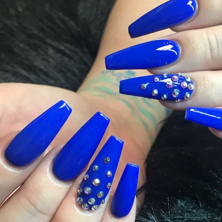 Chic Vibrant Blue Nail Design with Glossy Finish and Rhinestone Accent.