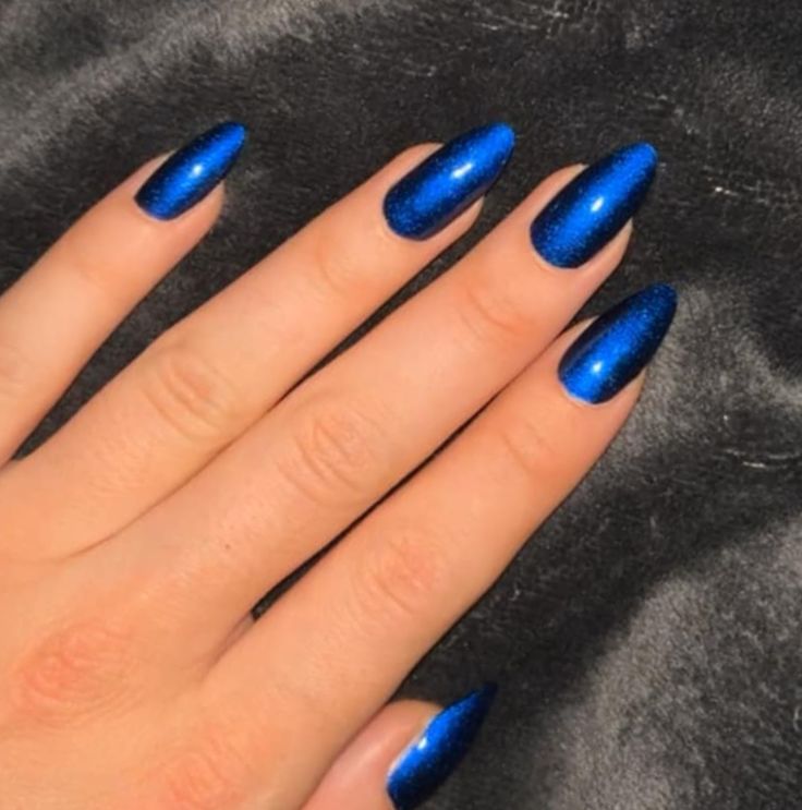 Elegant Shimmering Blue Stiletto Nails for a Bold Statement.