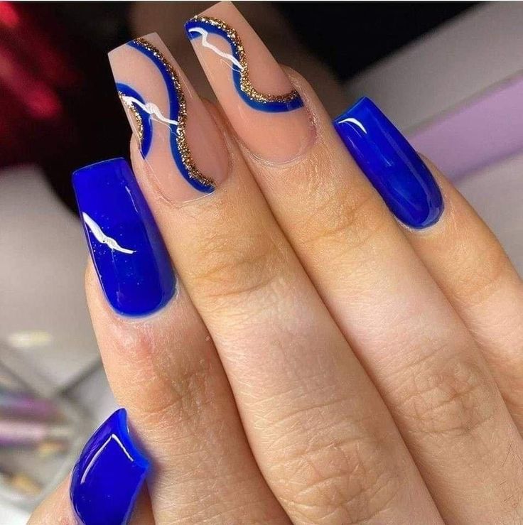 Chic Blue Nails: A Stunning Blend of Glossy and Matte Finishes with Elegant White and Gold Accents.