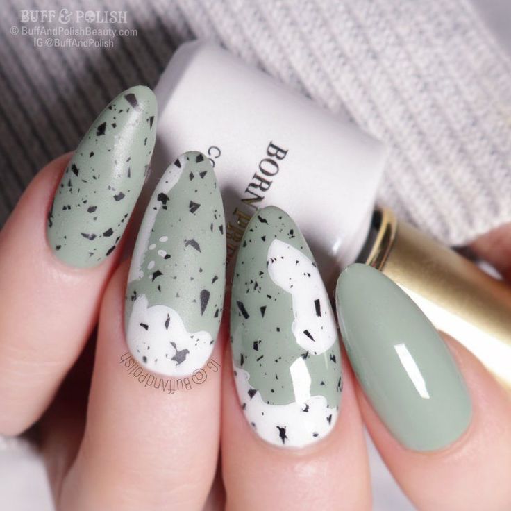 Trendy Chic Nail Design in Muted Green with Textured Finishes and Elegant Almond Shapes.