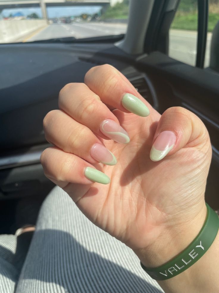 Chic Almond-Shaped Nail Design with Soft Green and Transparent Pink Gradient.