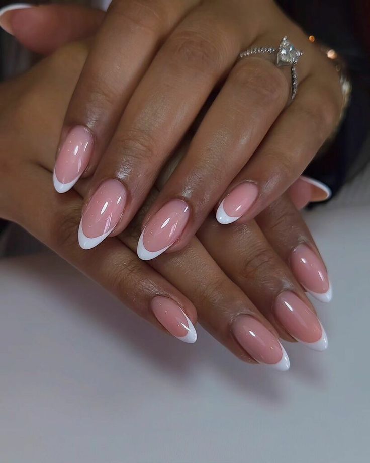 Chic Elegance: Blush Almond Nails with Crisp French Tips and Glossy Finish