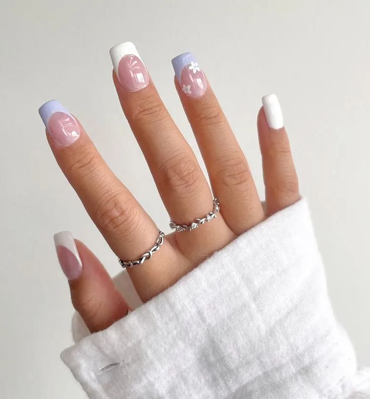 Chic Pastel Nail Design with Floral Motifs and Silver Accents