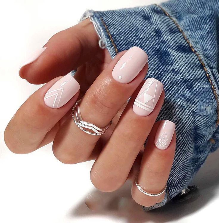 Chic Pink Nail Design with Geometric Patterns and Minimalist Accents