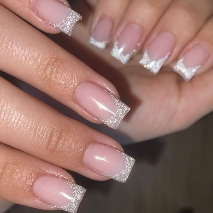 Chic Soft Pink Nails with Sparkling Silver Tips: A Sophisticated Blend of Elegance and Glamour.