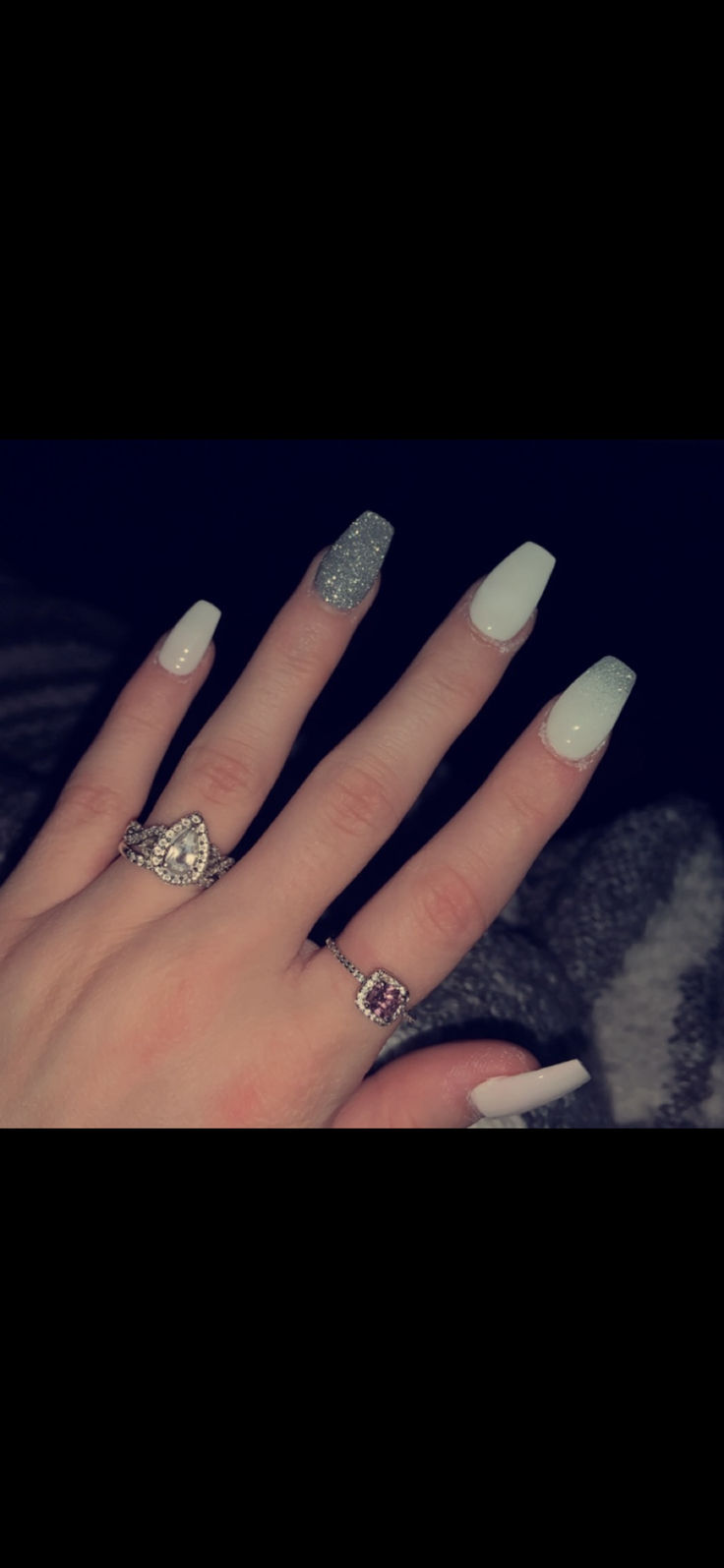 Chic Long Square Nail Design with Glossy White, Shimmering Silver, and Elegant Rings.