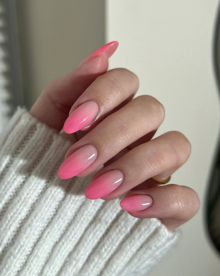 Elegant Ombre Pink Nails: A Soft Gradient in Almond Shape for Every Occasion